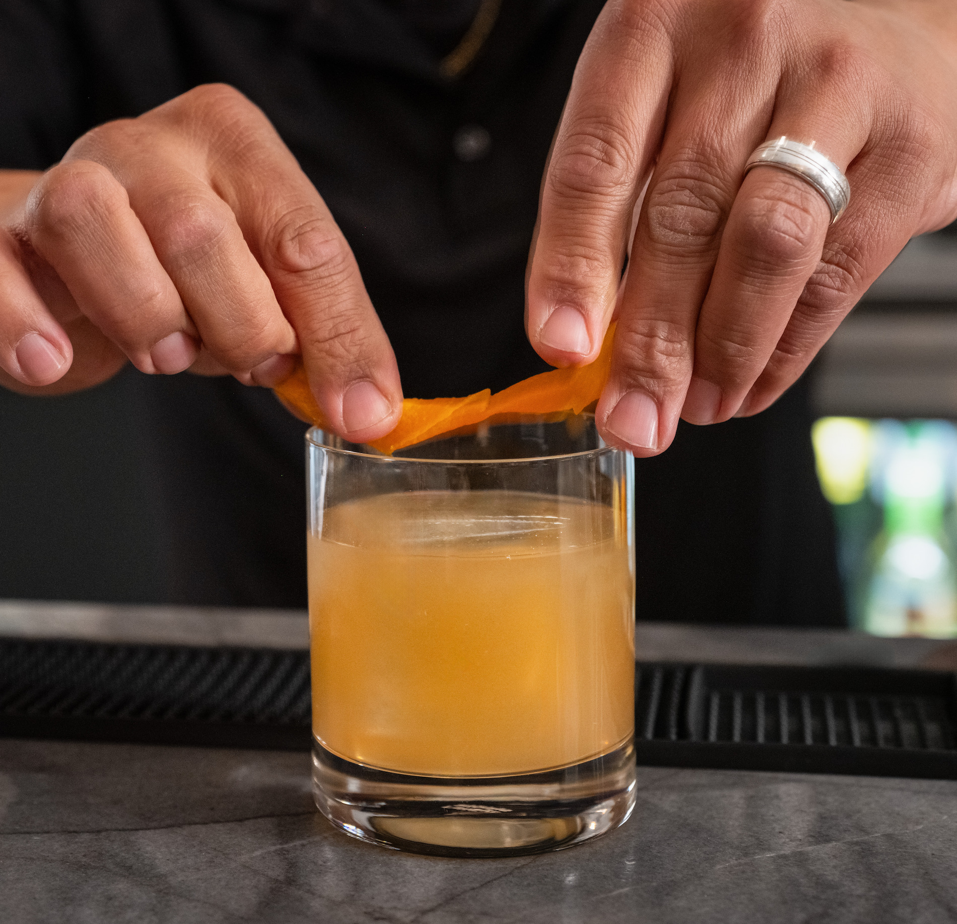 Craft cocktail being poured at the bar